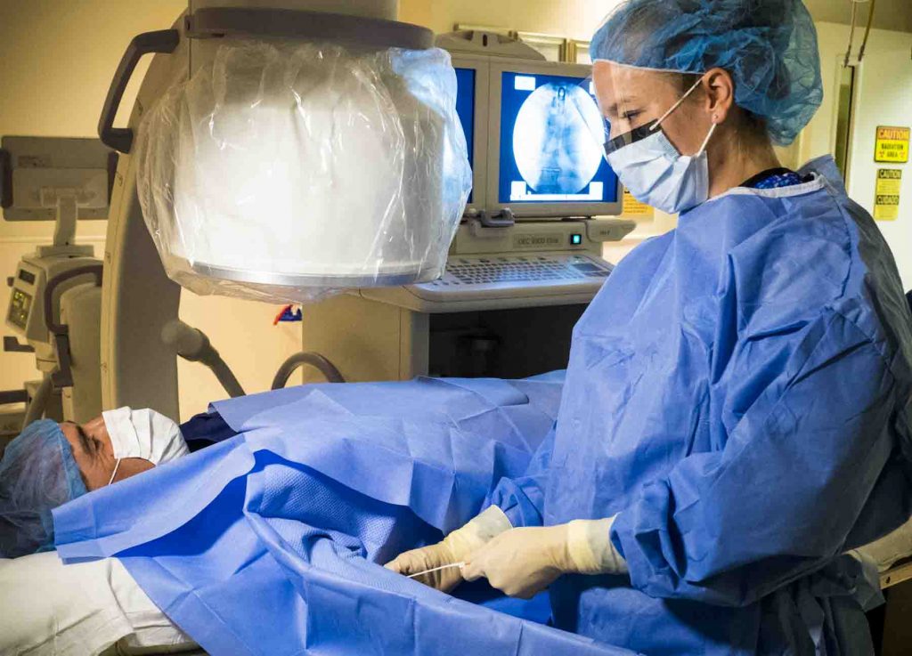 Suzanne Shelling, PA-C performing a fluoroscopy on a patient