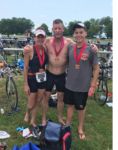 Ted Brennan with his wife Jennifer and son at a triathlon