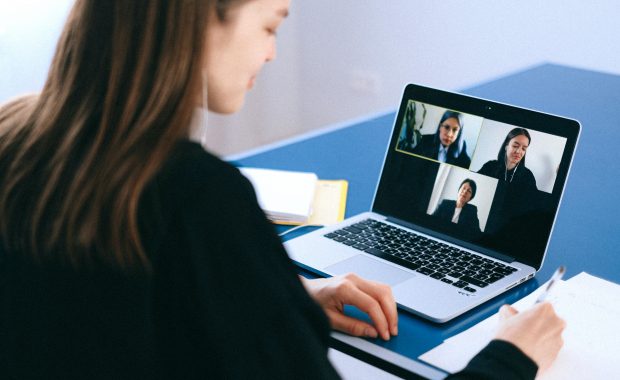 Person videocalling with three others