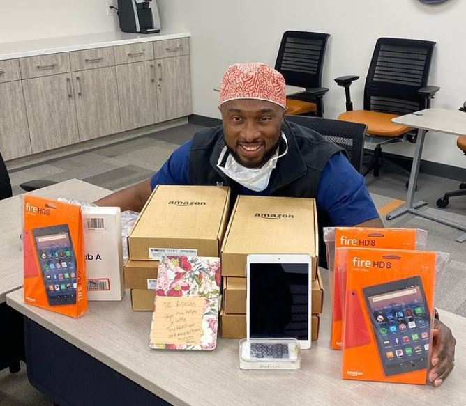 Tony Adkins with donated and fundraised tablets