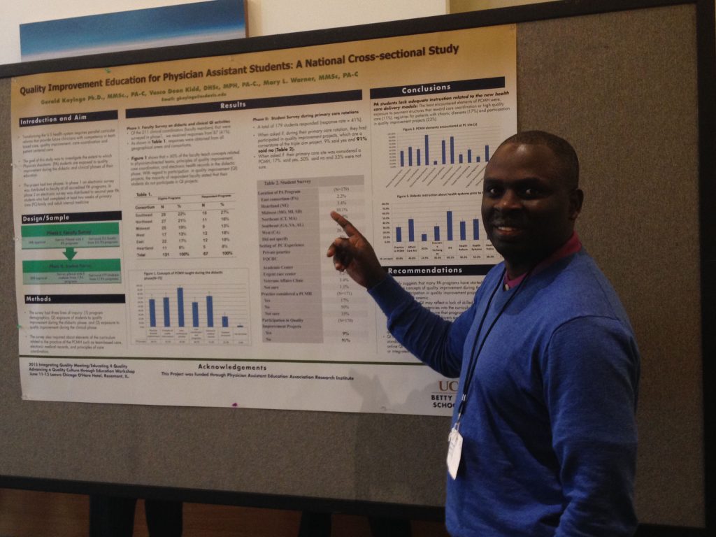 A man points to a scientific poster.